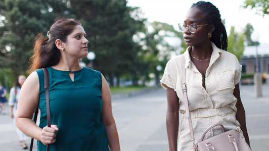 Two women students walking at the UVic campus