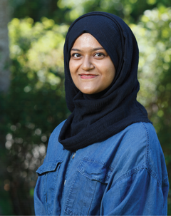 Profile photo of Shah Mostakima smiling to the camera with a green background