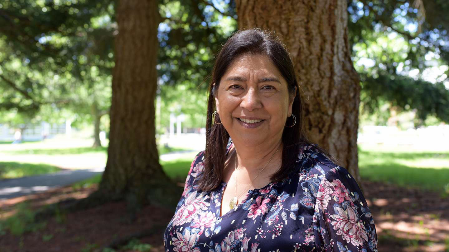 A portrait of Lisa Crowshoe on campus at UVic in Spring 2024.