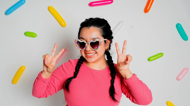student wearing heart sunglasses