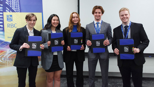 A picture of the winners of the 2024 RBC Case Competition pose with their prize