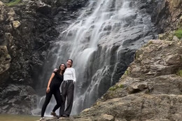 Exchange Ambassador Christina poses with a friend at a waterfall in Chile