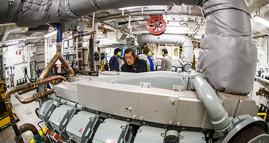 Dong and team working in the engine room of a BC Ferry