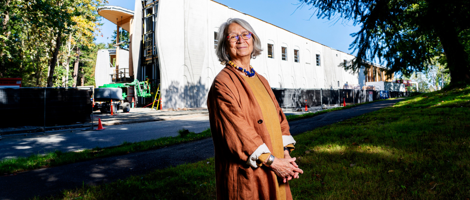 Image of Val Napoleon, posing in front of the under-construction NCIL